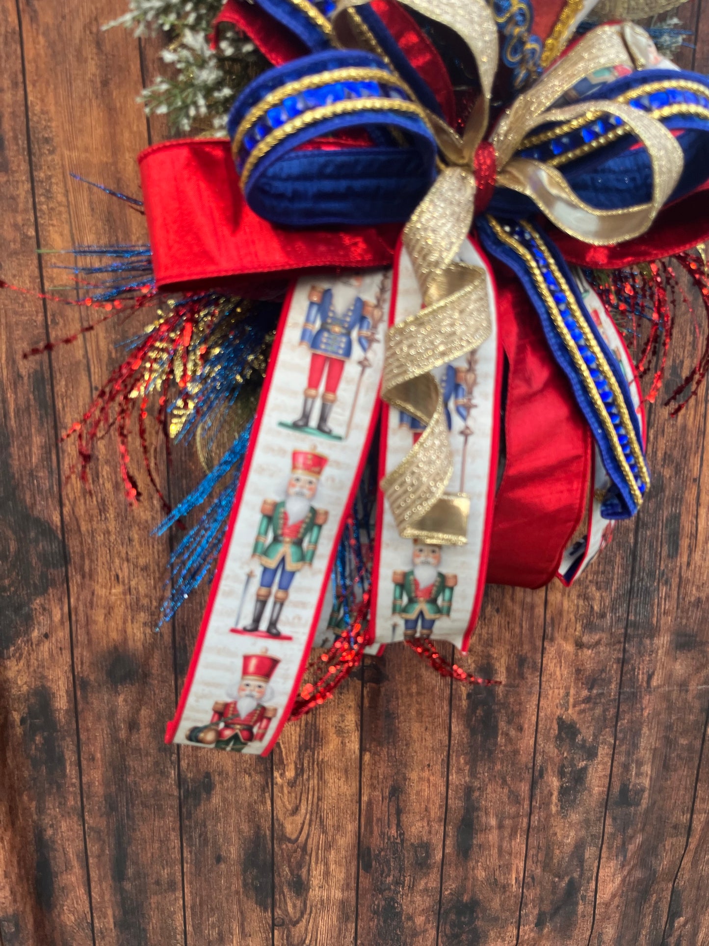 Nutcracker Drum Christmas Swag – Red, Blue & Gold Holiday Door Decor with Glitter Picks & Nutcracker Ribbon